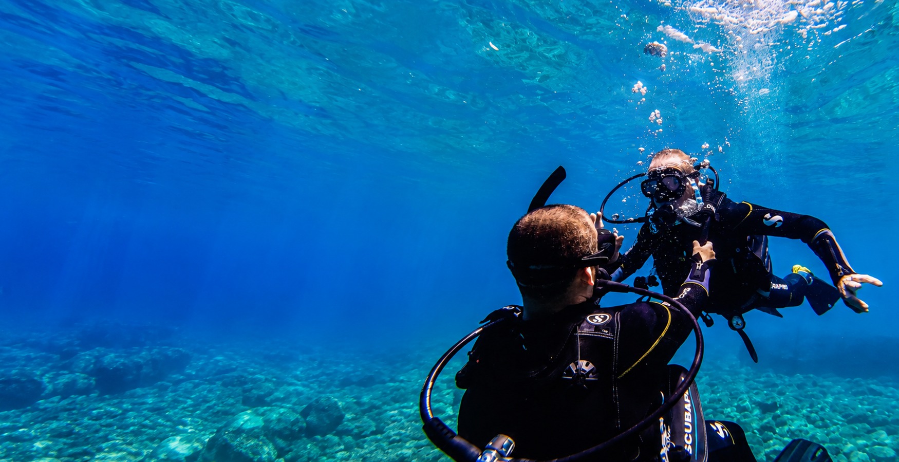 Dimitrios V. Smirnich working directly with another scuba diver underwater