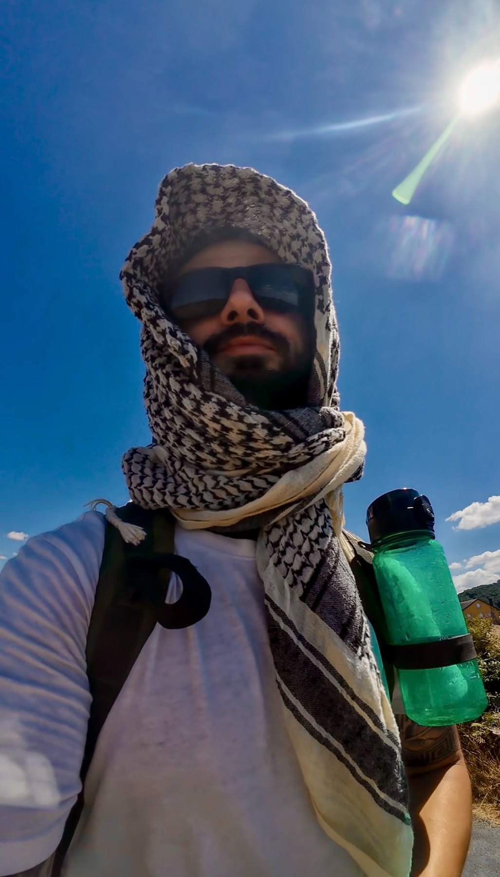 Dimitrios V. Smirnich travelling with a backpack in hot weather
